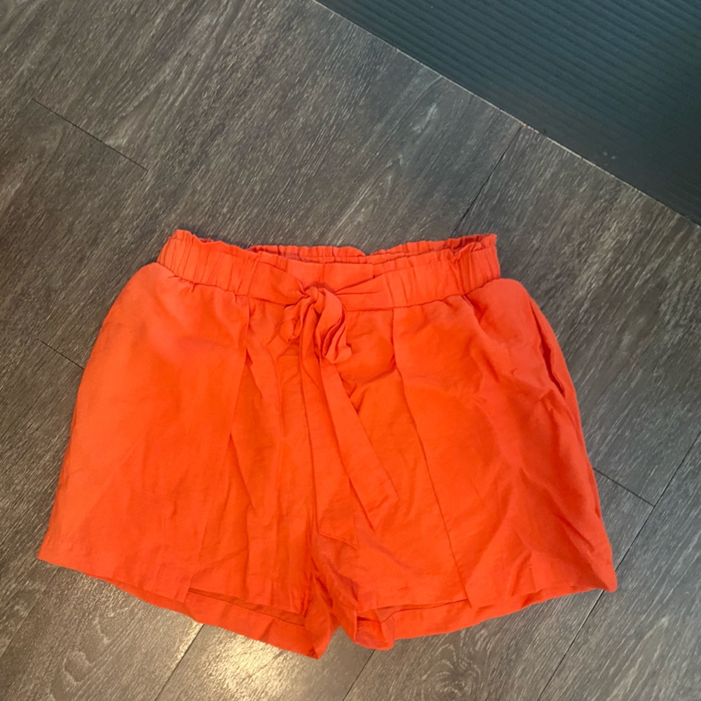 Size medium boutique shorts. NWOT. Orange and flowy. Tie up front